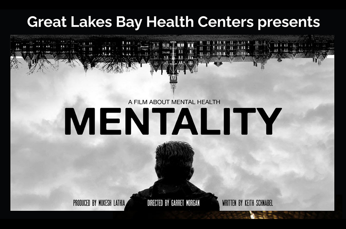 moody poster image of back silhouette of person looking at buildings